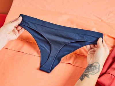 woman checking underwear fit quality fabrics