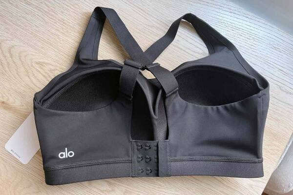 A close-up on the wide, strong bottom band of a high-impact sports bra, showing its texture and construction.