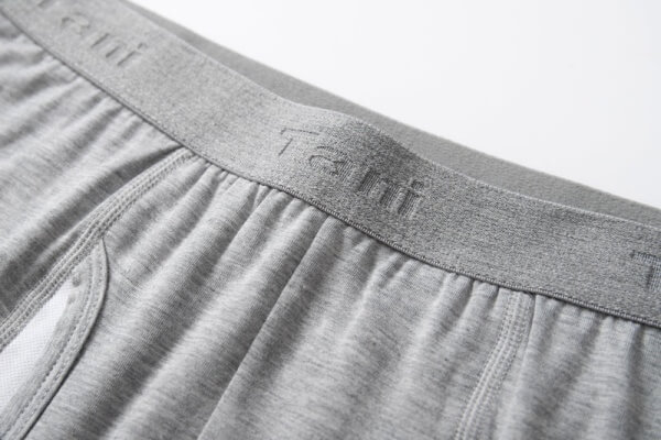 A close-up, high-quality shot of a well-crafted jacquard waistband on a pair of men's boxer briefs.